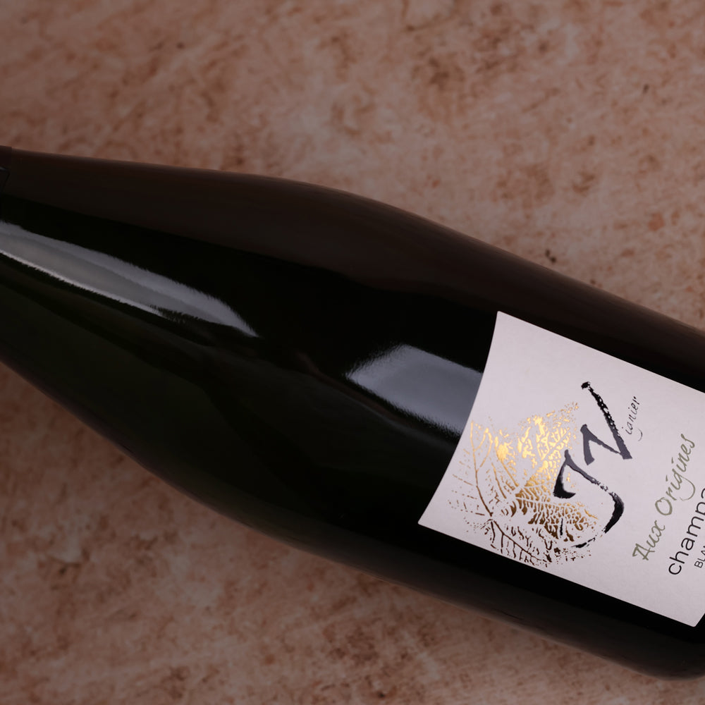 A bottle of NV Champagne J.Vignier Aux Origines Blanc de Blancs 750ml Sparkling Wine