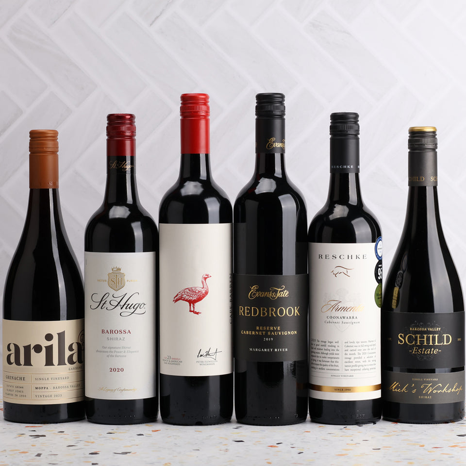 A collection of Mystery Revealed Red 6pack from The Wine Collective